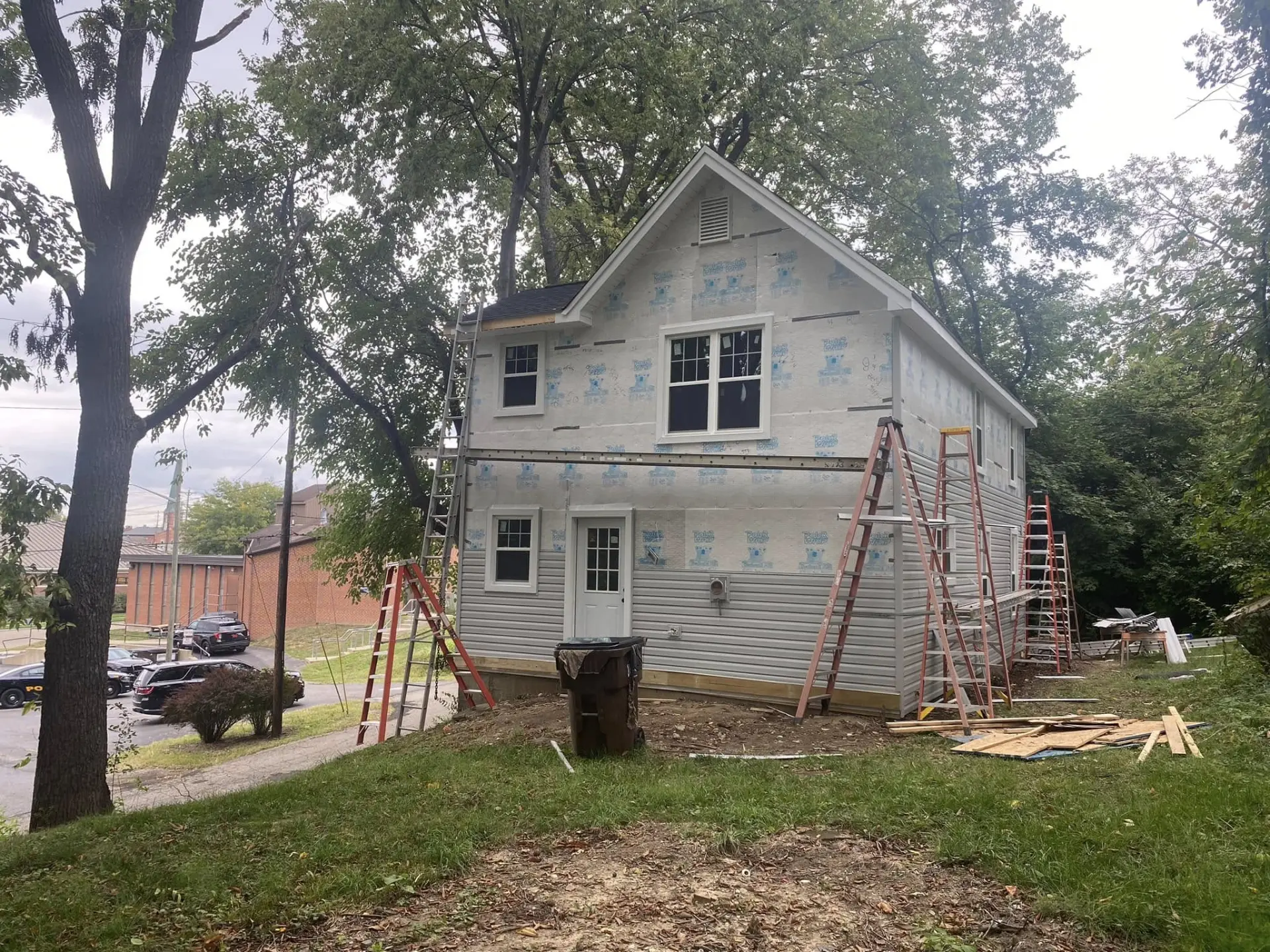 Two-story house during exterior renovation work by our team